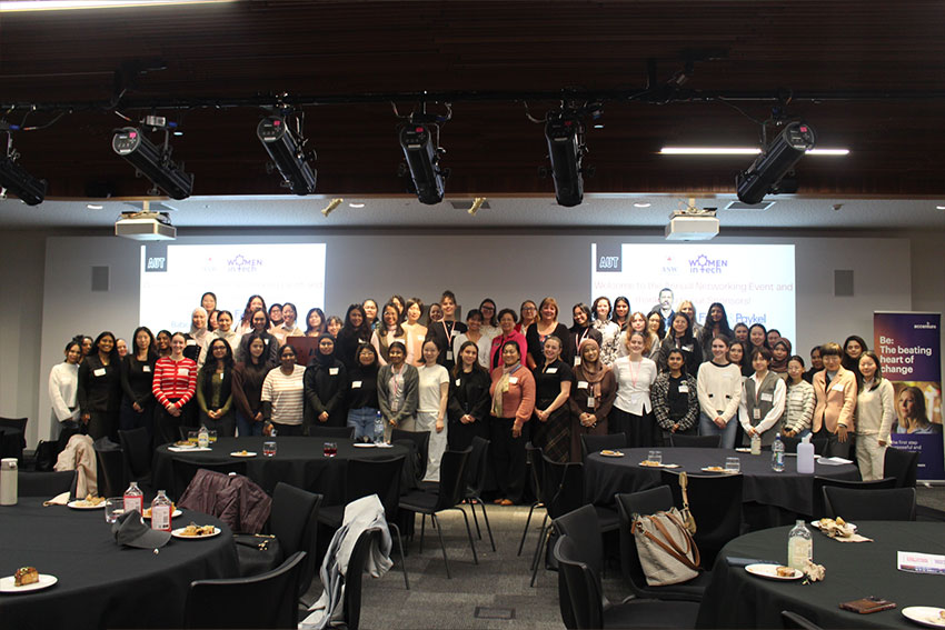 Women network and take a group photo